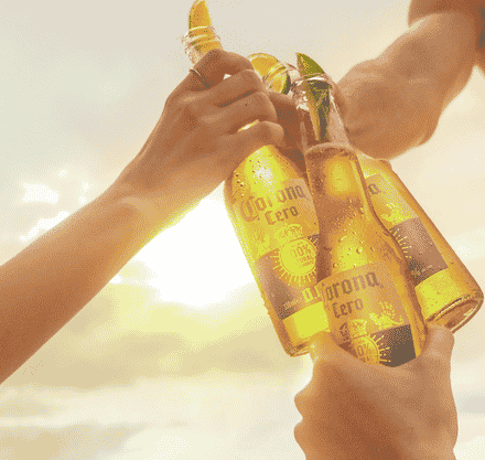 Place the lime wedge into the bottle or can and enjoy